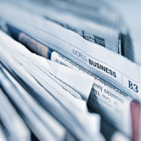 Image showing a group of newspapers stacked together.